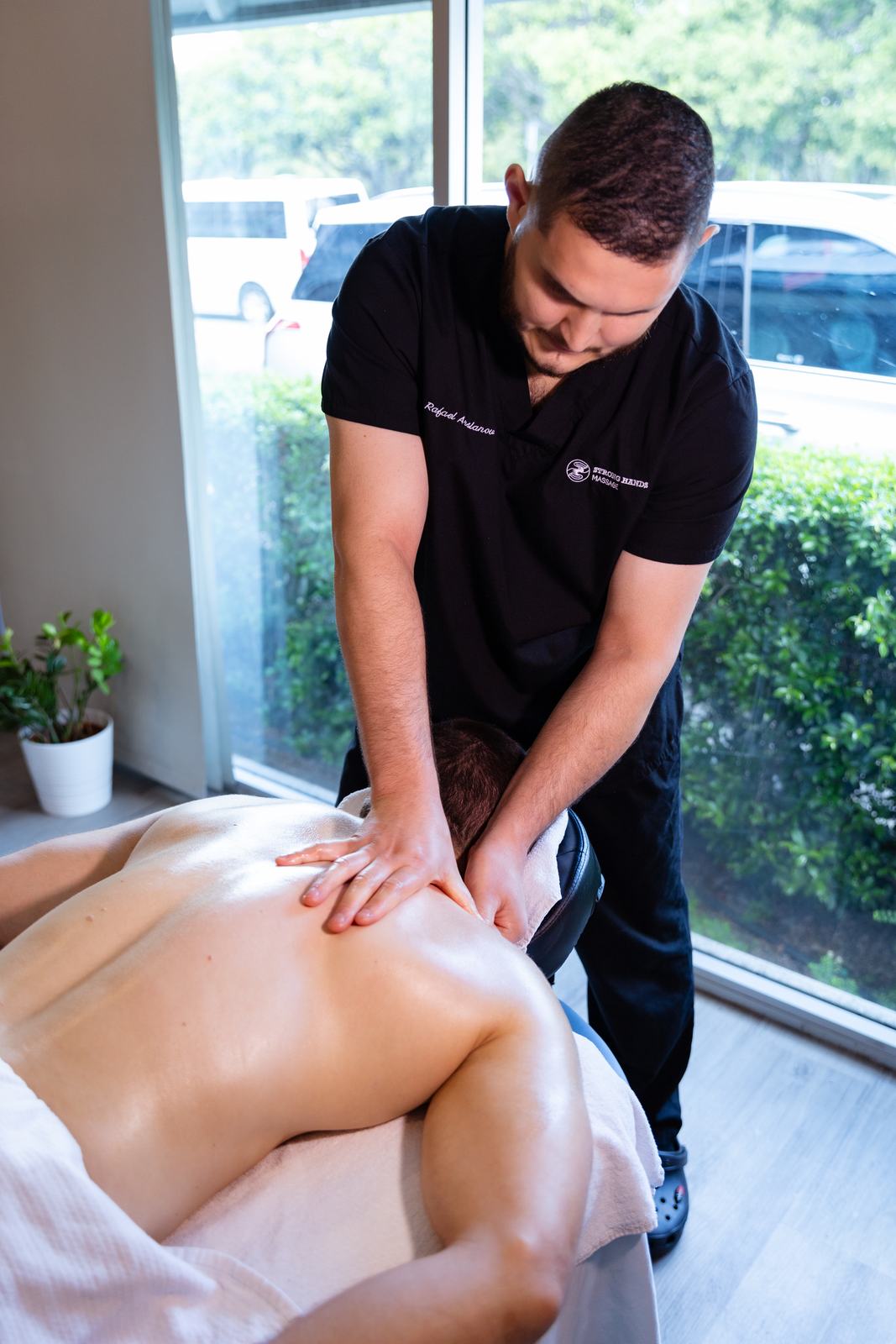 Rafael working on a client's lower back