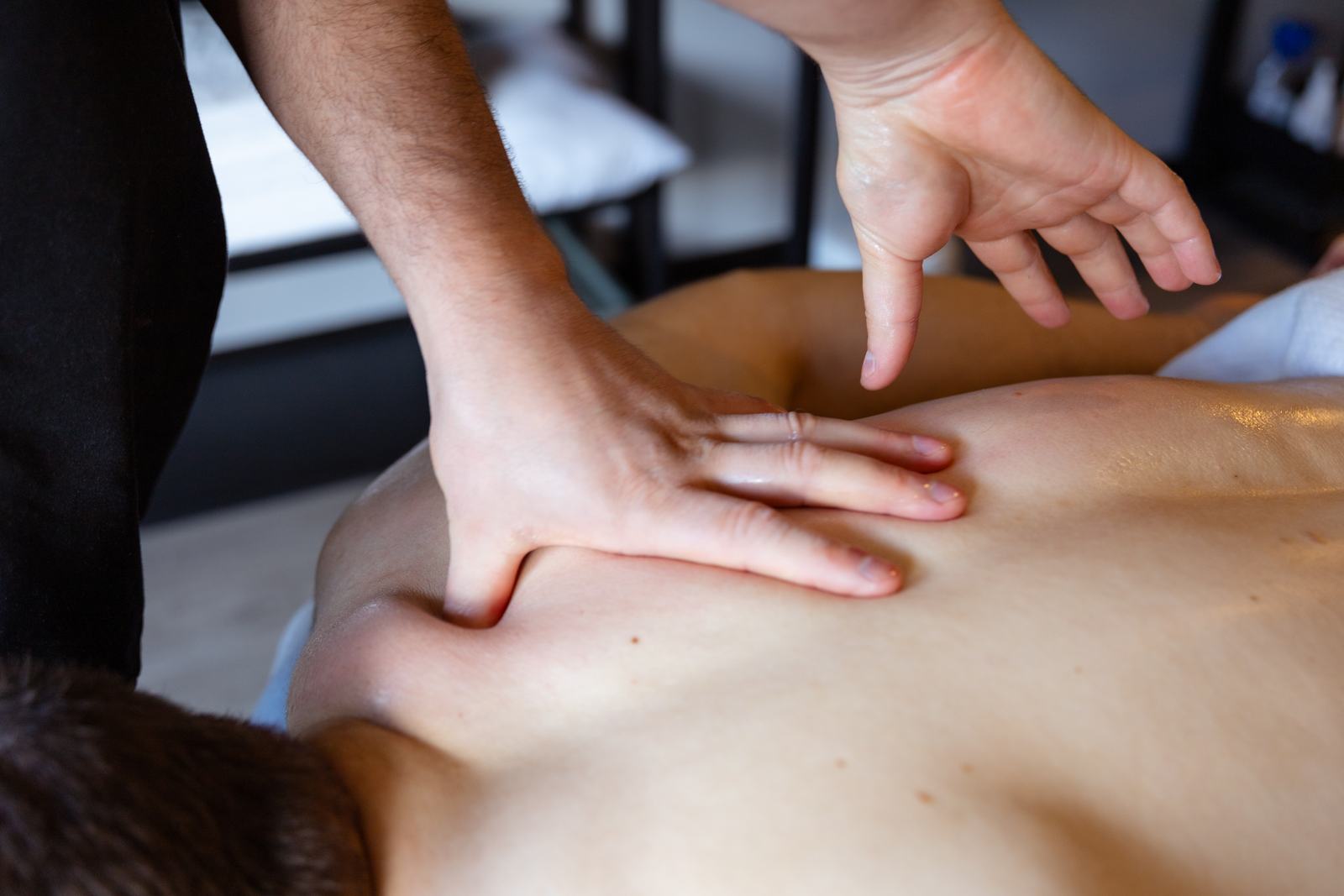 Rafael working on a client's back